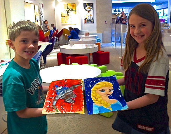 Student holding their artwork.