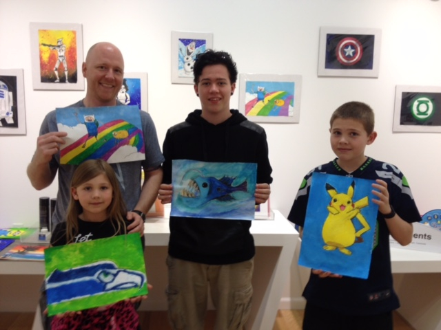 Student holding their artwork.