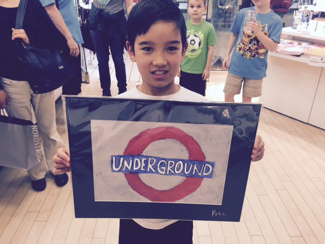 Student holding their artwork.
