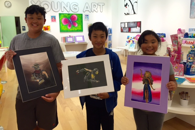 Student holding their artwork.
