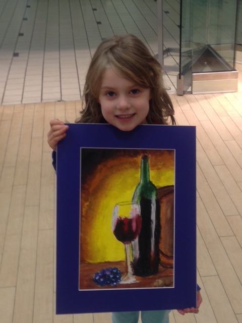 Student holding their artwork.