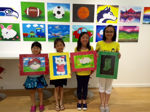 Student holding their artwork.