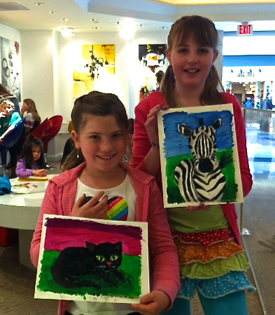 Student holding their artwork.