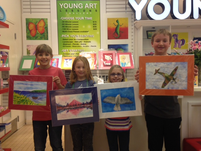 Student holding their artwork.