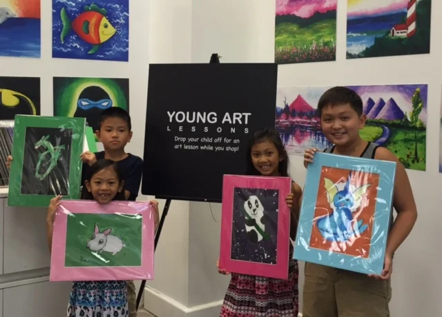 Student holding their artwork.
