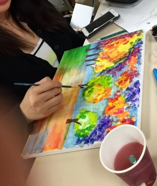 Image of a woman painting.