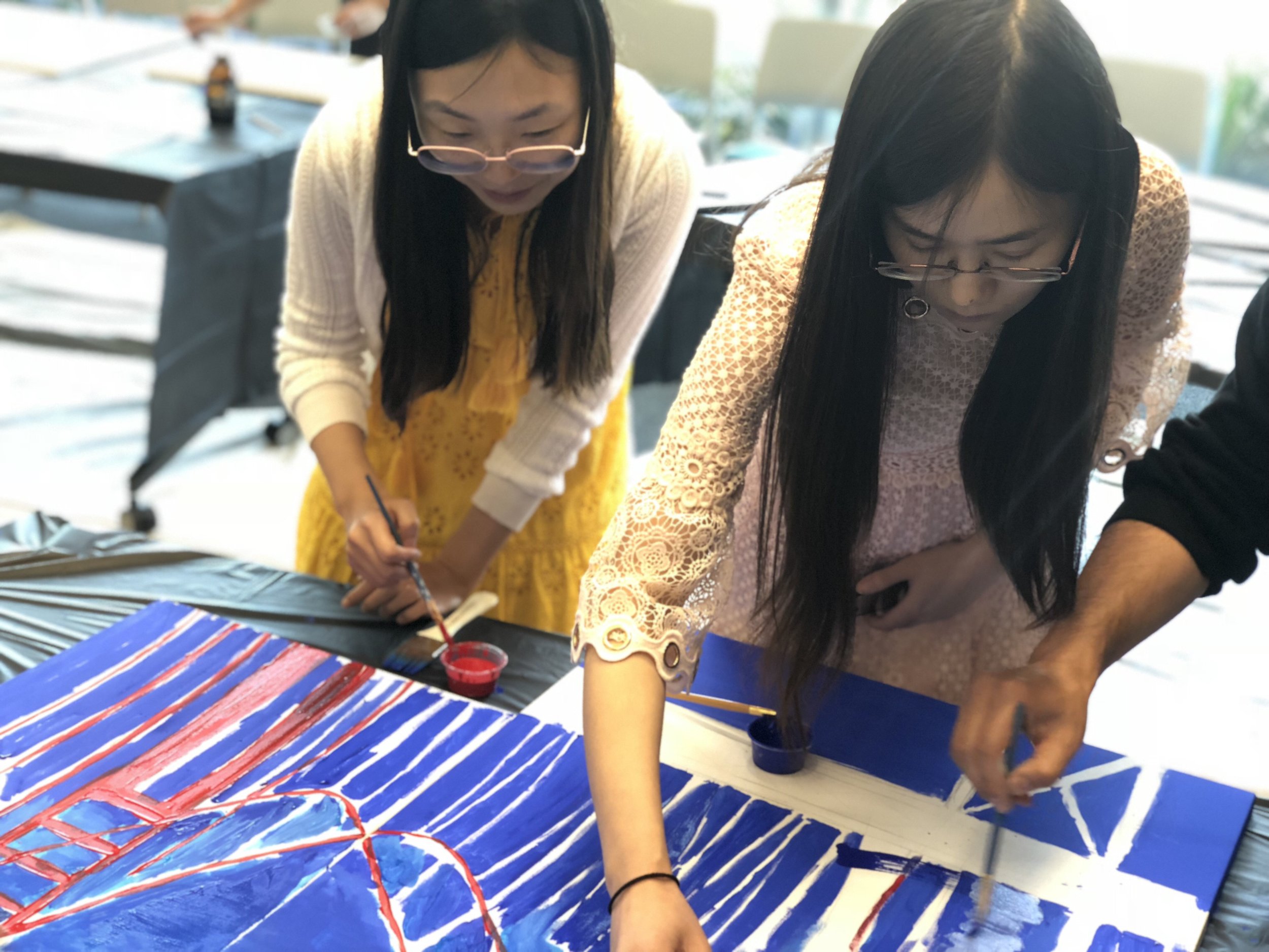 Image of people painting.