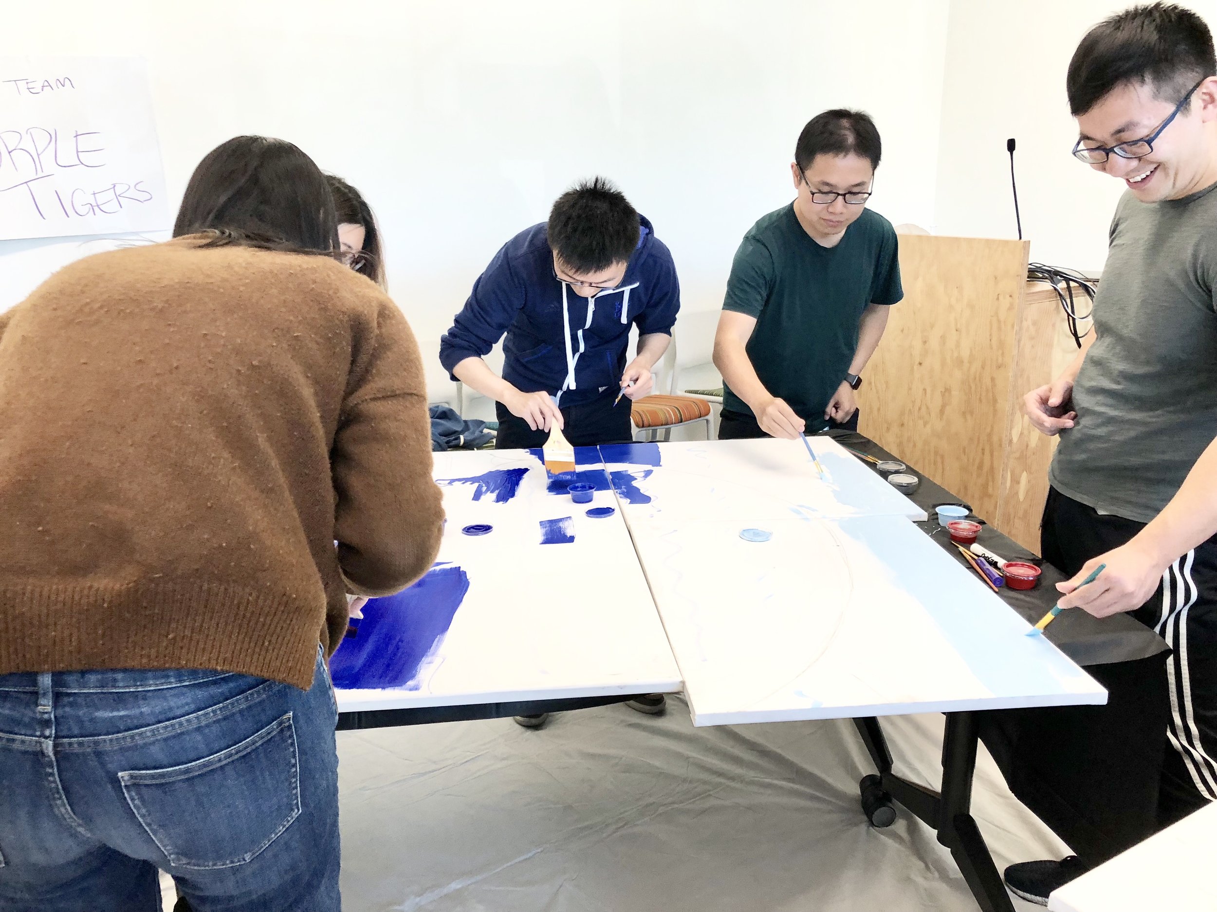 Image of people painting.