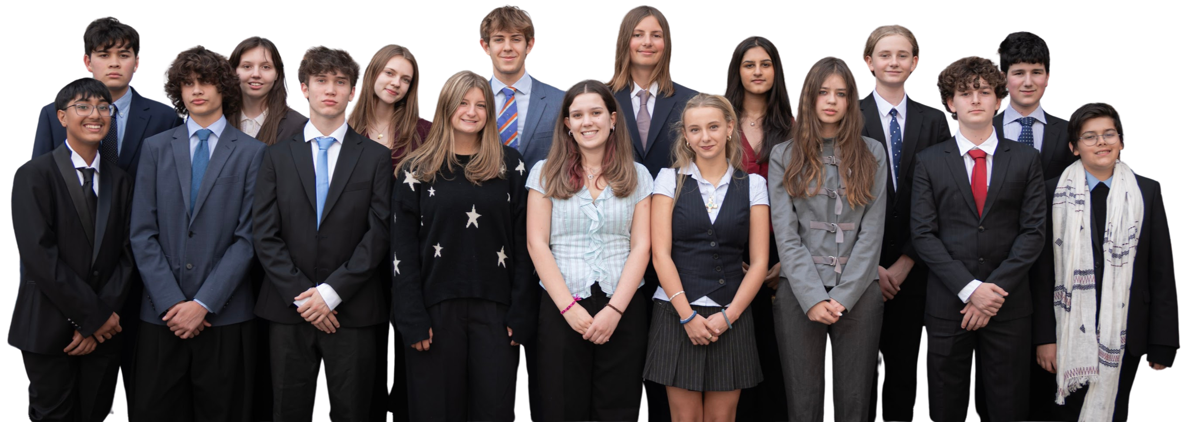 A group of 16 diverse teenagers dressed in formal and casual attire posing together for a photo.