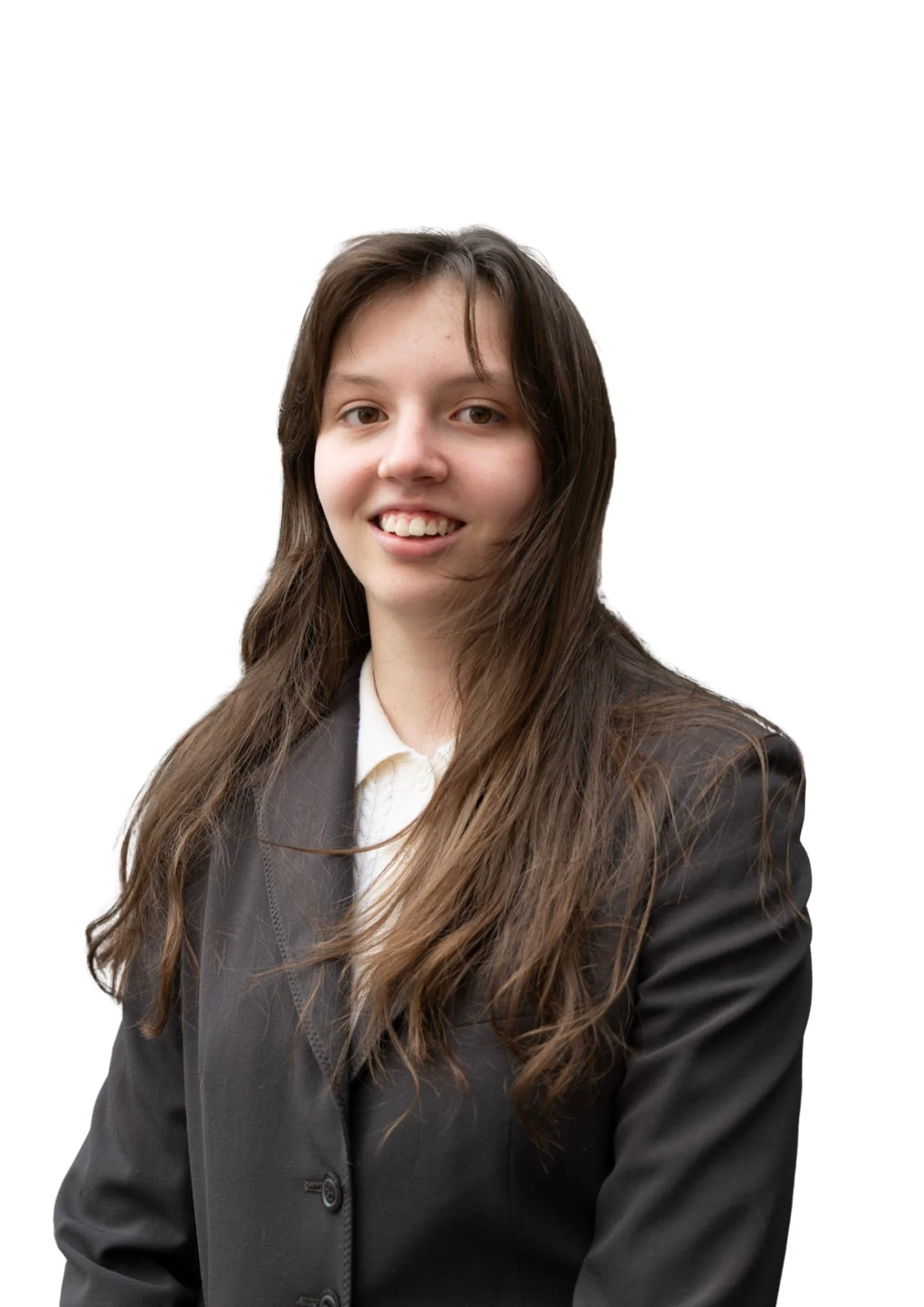 Portrait of a young woman with long brown hair wearing a black blazer and white shirt, smiling slightly, against a white background.