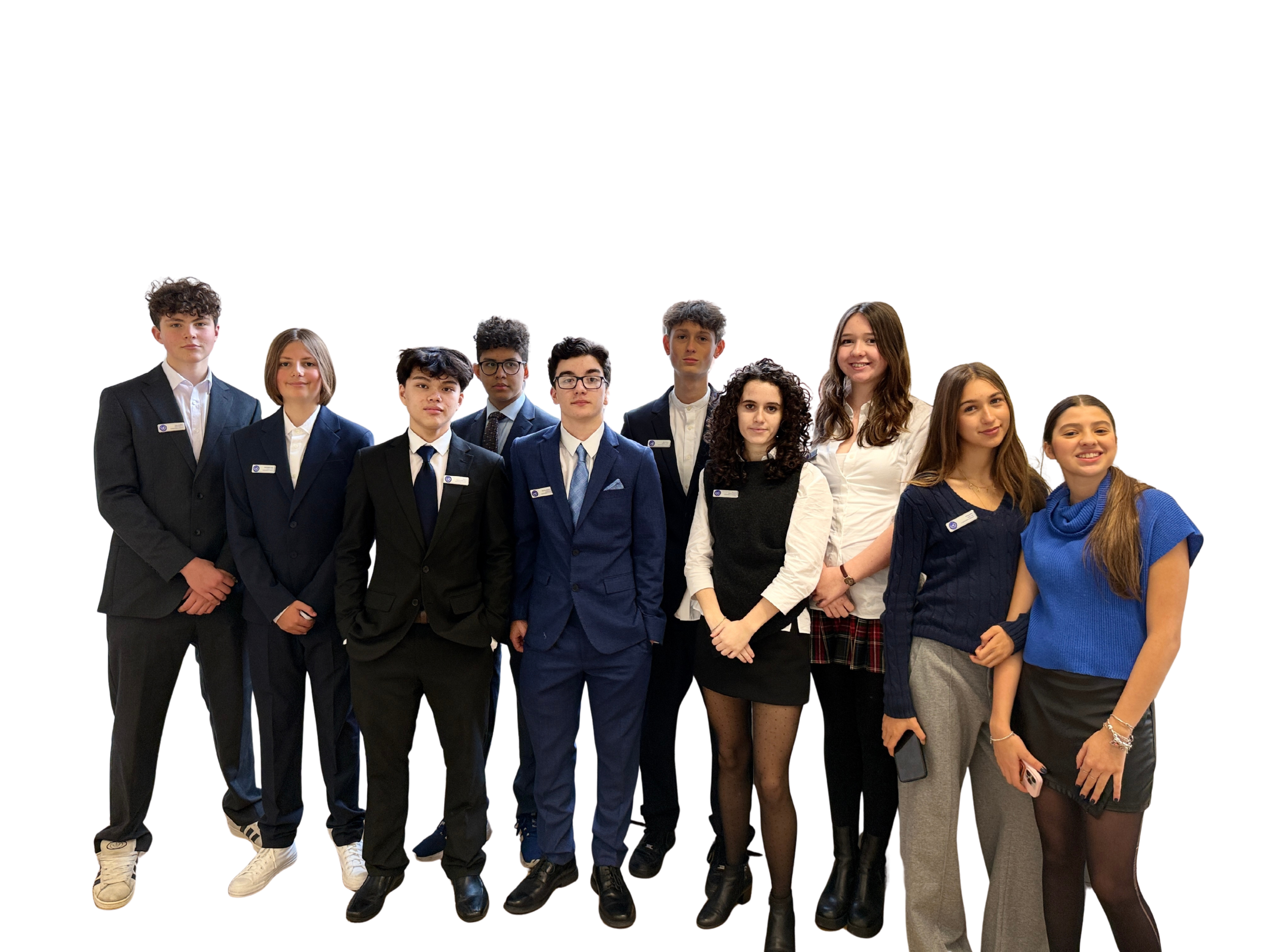 Group of young people dressed in formal and casual attire, standing together against a white background.