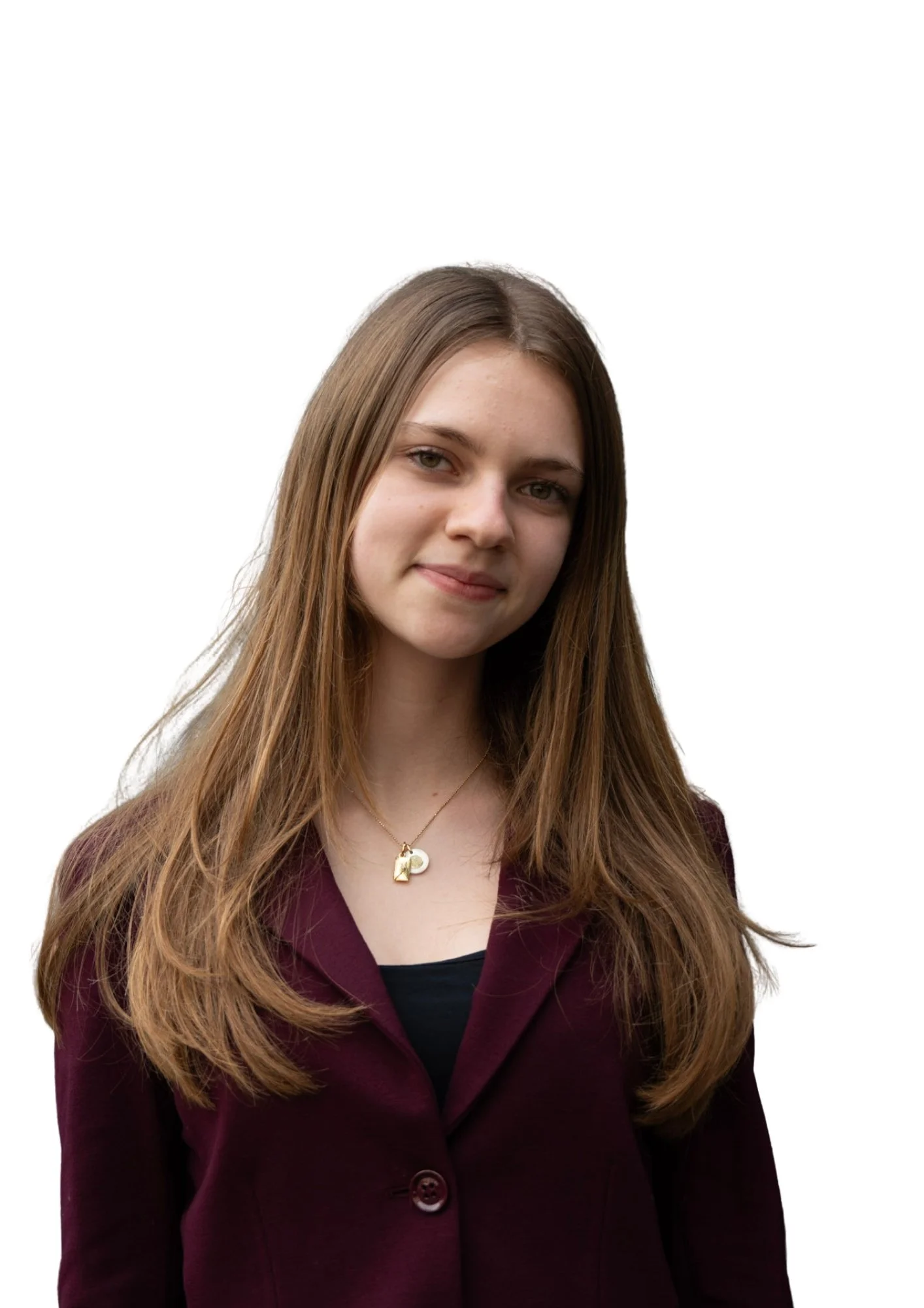 A young woman with long, wavy brown hair, wearing a burgundy blazer and a necklace with a pendant shaped like a letter P, smiling lightly, against a plain white background.