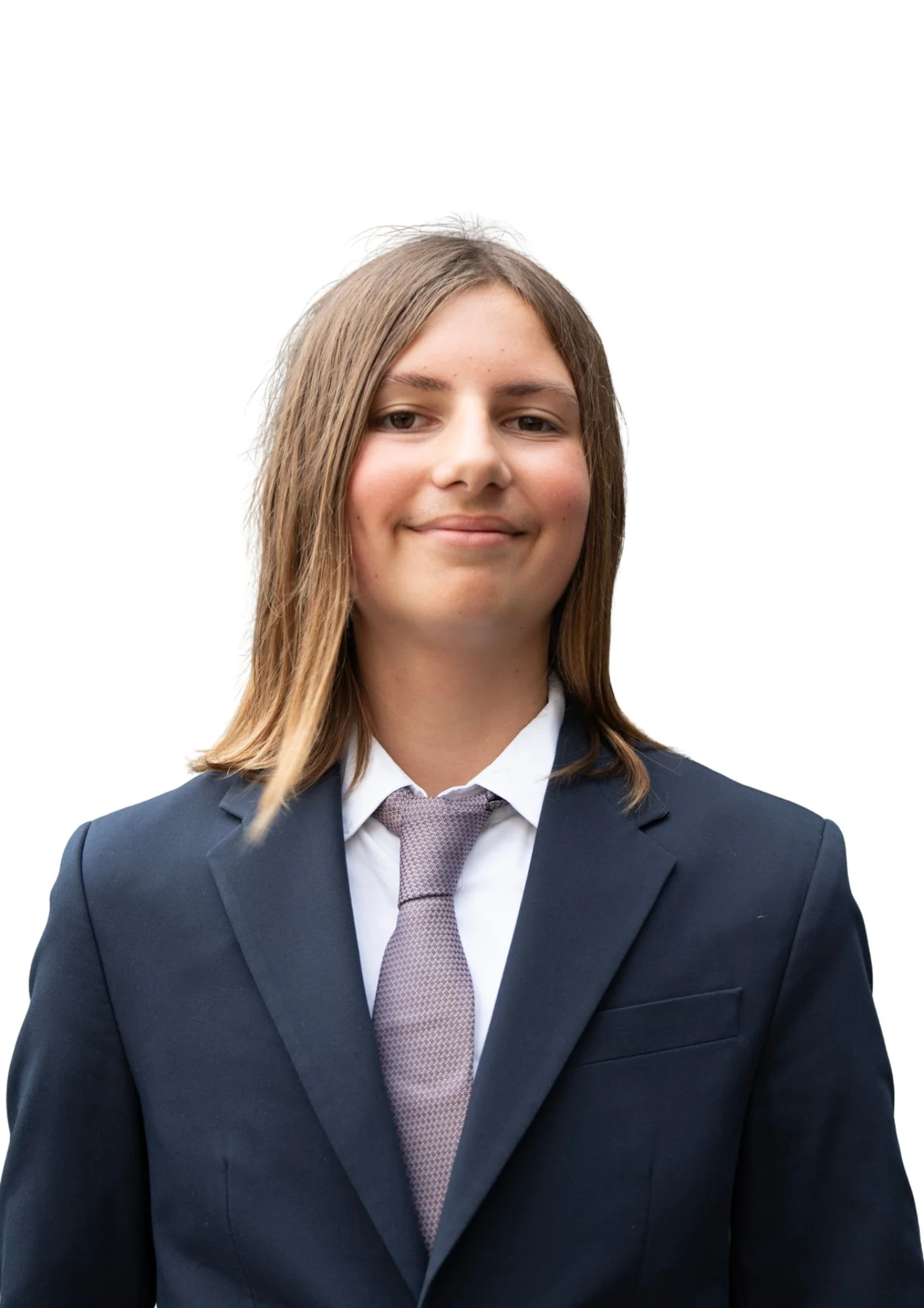 Portrait of a young woman wearing a navy blue suit and a light pink tie, smiling with long brown hair, against a white background.
