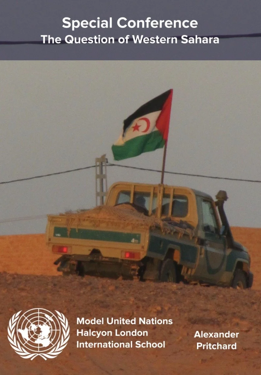 Poster for a special conference titled 'The Question of Western Sahara' featuring a yellow and green vehicle with a flag of Western Sahara attached to it, against a desert background, with the United Nations logo and text for the Model United Nations Halcyon London International School, authored by Alexander Pritchard.