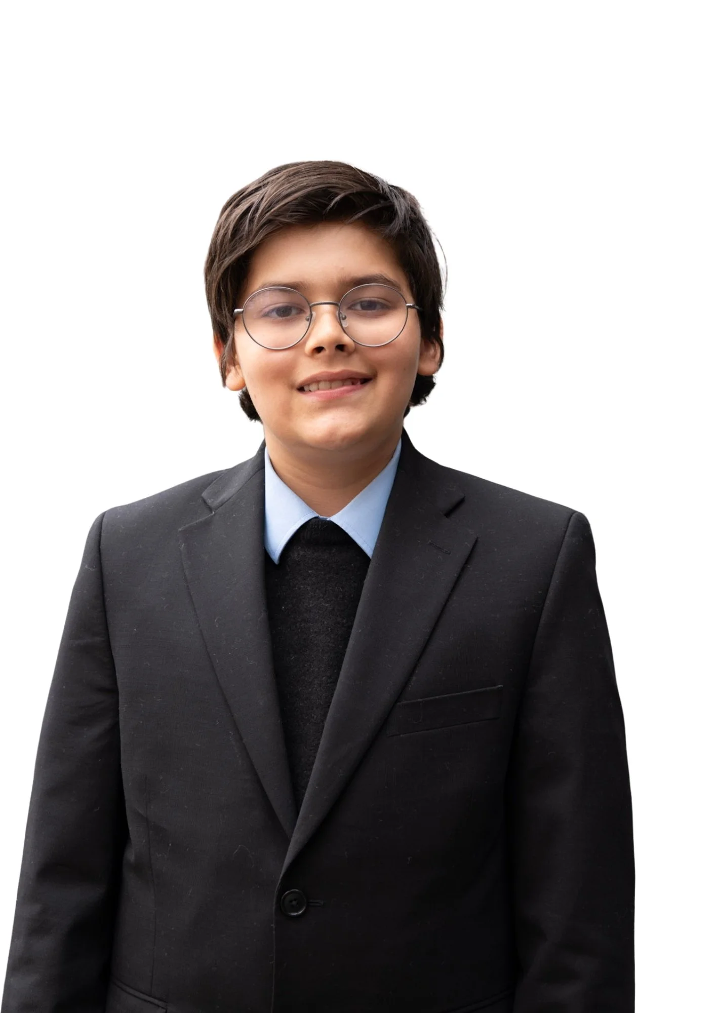 Portrait of a young man with dark hair, glasses, wearing a dark suit, light blue shirt, and tie, smiling slightly, against a white background.
