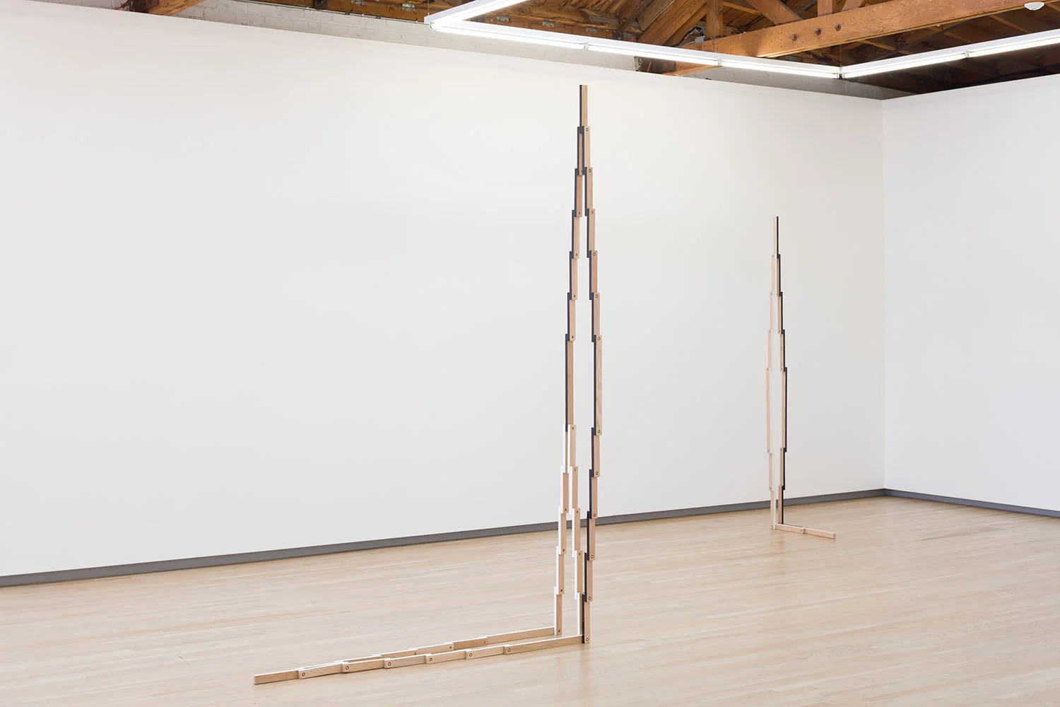 In Four Acts, installation view. Shulamit Nazarian Gallery, LA, 2018 When the sculptures are set into their final, open positions, they often contain more negative space than mass, which allows the surrounding architecture to further inform and complicate the exhibition. The sculptures point to a broad range of references, from the staggered pixelation of enlarged digital images to the dense geometric patterns of indigenous weavings; their contours relate to architectural structures and have a physical presence that evokes the body. The four different expressions of the exhibition are separate acts, moments in time captured from a longer performance in which the sculptures become the actors and the gallery’s architecture becomes the stage.