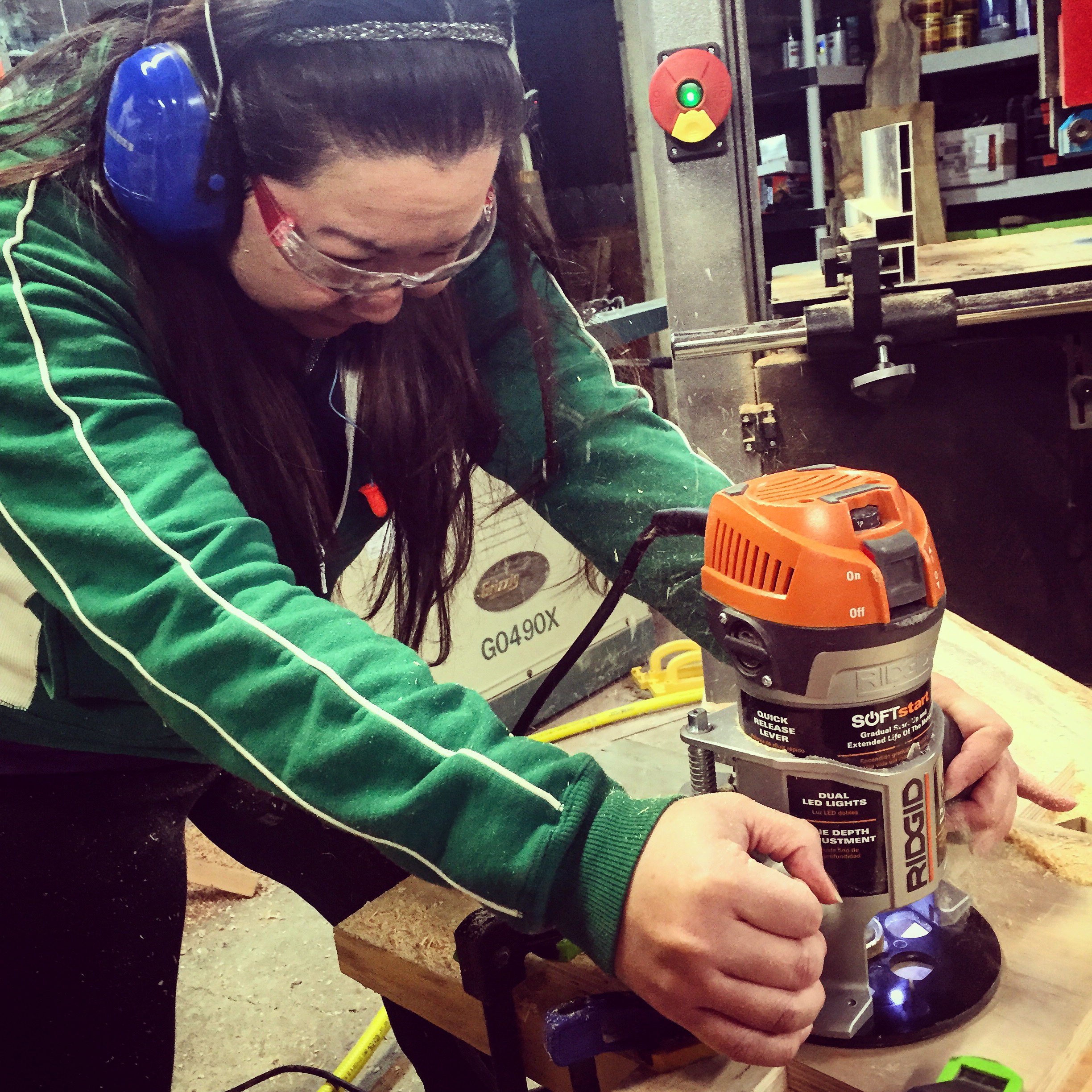 Yen using a router to cut out a through mortise.