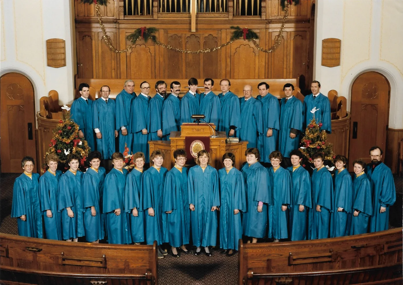 Knox Choir, December 22, 1985 Back Row L-R: Larry Skinner, Charlie Corry, Sam Johnston, John Semple, Don Fischer, Don Harrison, Peter Corry, Paul Karges, Hugh Walker, Halley Nickel, Jim Walker, Rae Fischer, Jim Henderson Front row L-R: Louise Cowen, Jan Stewart, Sherry Stewart, Kim Henderson, Marcie Johnston, Sandie Arlein, Jill Reading, Jeanne Fischer, Darlene Galbraith, Kelly Henderson, Kim Tozer, Ethel Corry, Nancy Orth, Mary Lynn Sleightholm, Lori Henderson, Nancy Skinner, Brian Emery (Director)