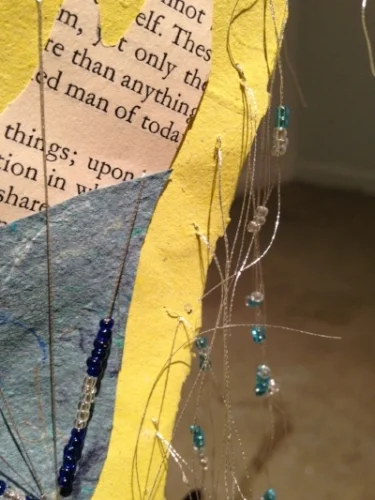 Sail Far, Far Away, detail, iron rod, handmade papers, book page, metallic thread, beads