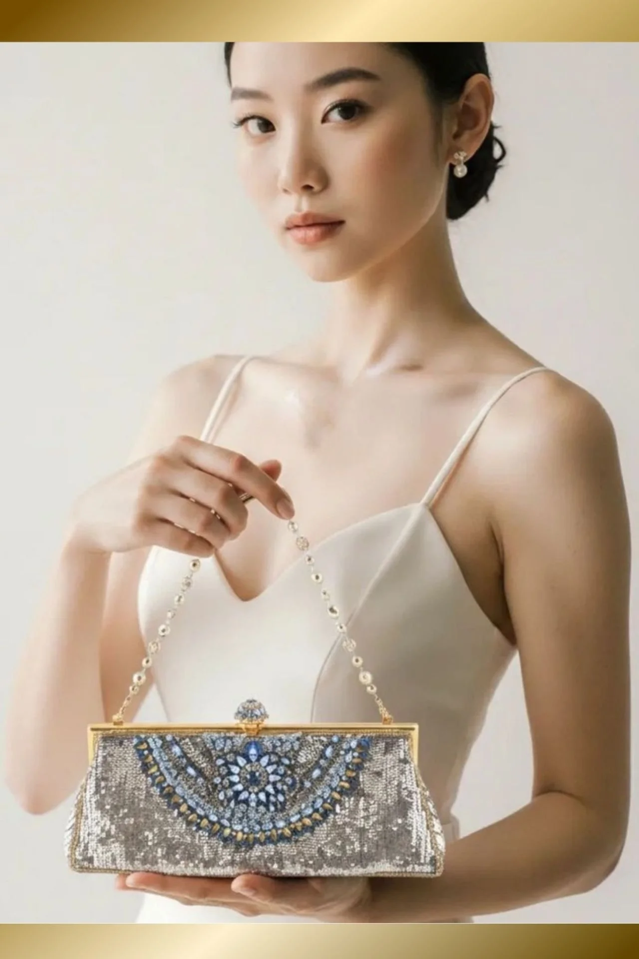 silver:pale gold:aqua beaded bag in model hands.jpg
