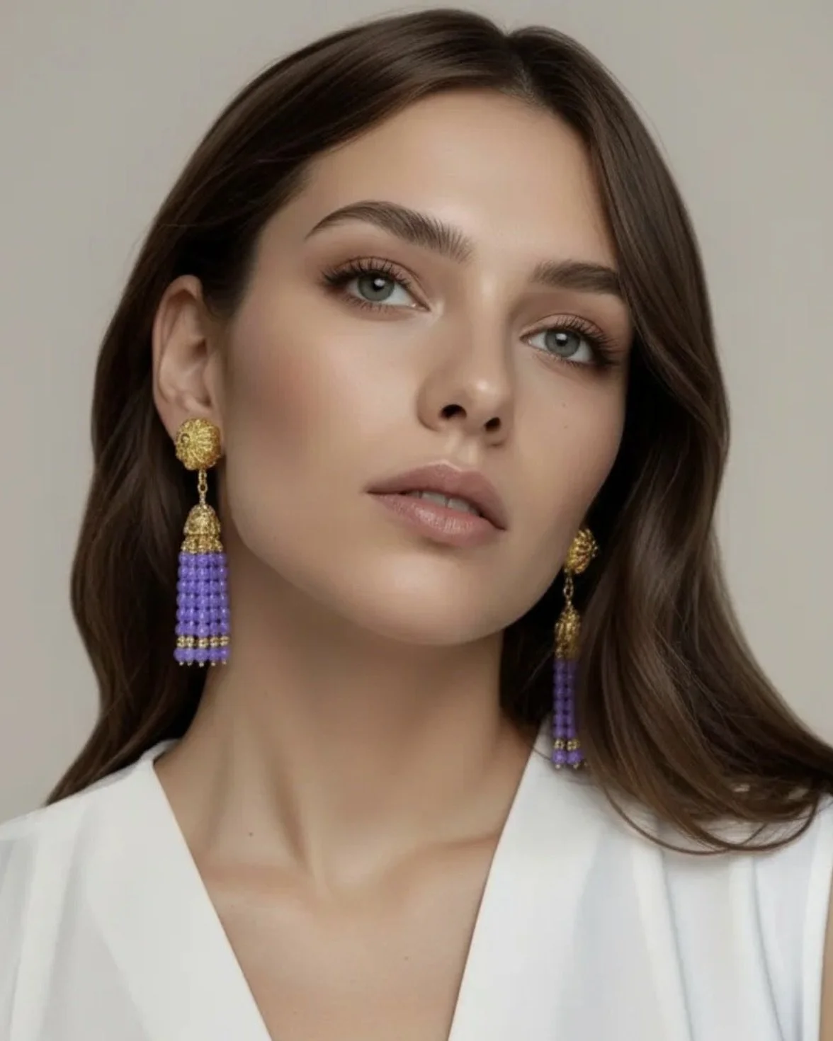 lilac tassel earrings on model front facing.jpeg