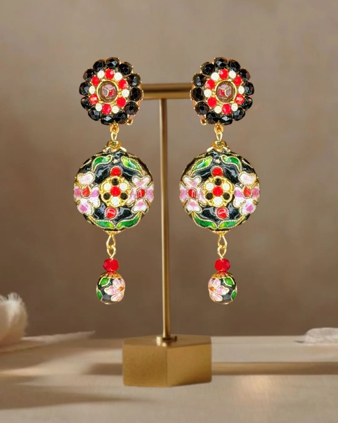 Blk red opal cliosonne earrings still life with brass stand.jpg