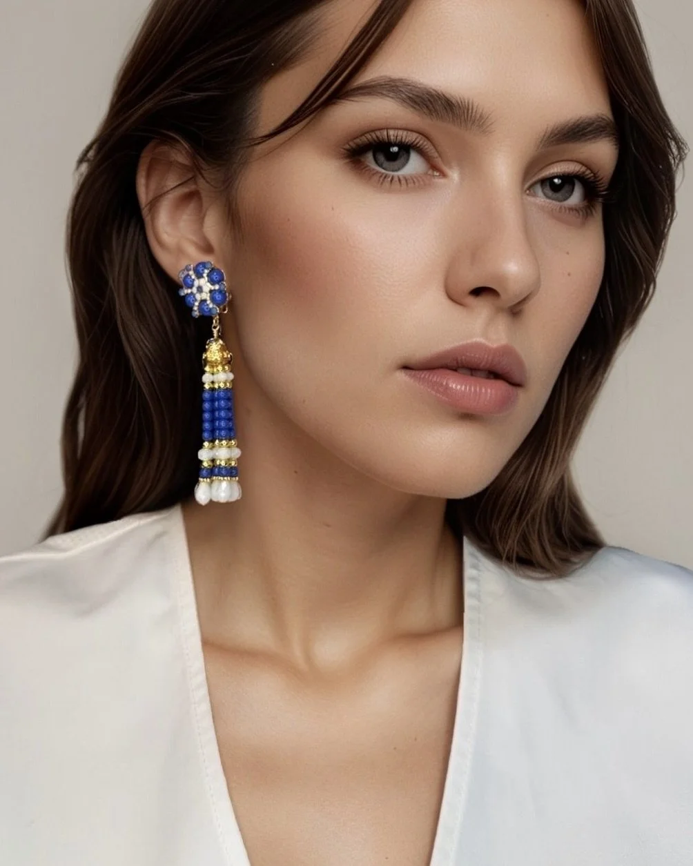 blue and white starburst earrings on model.jpeg