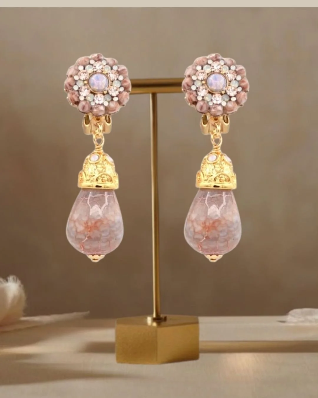 nude drop earrings on still life stand-nude.jpg