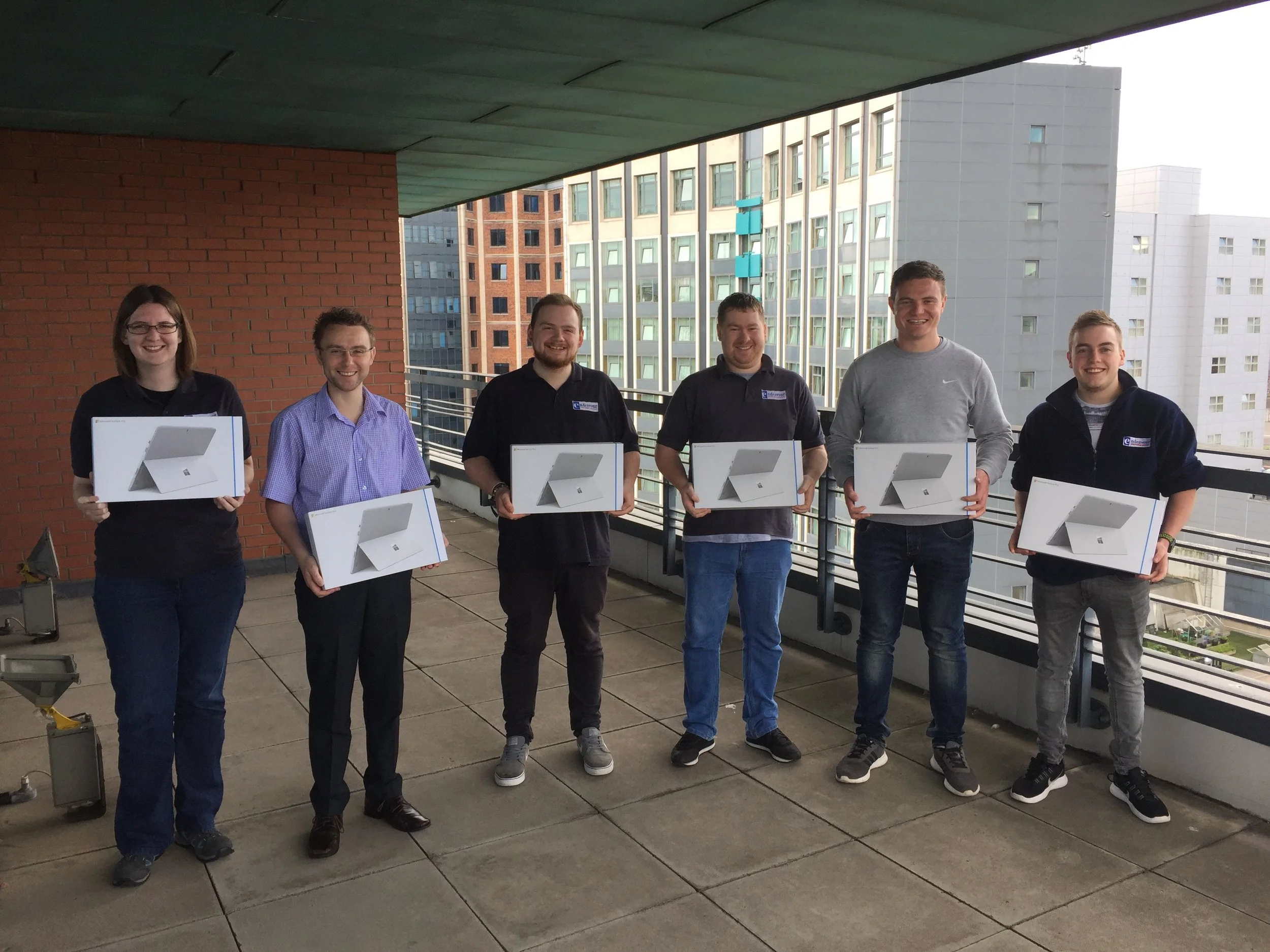 Kelly, Gary, Matthew, Steven, John and Sean all receiving their new Surface Pro devices.