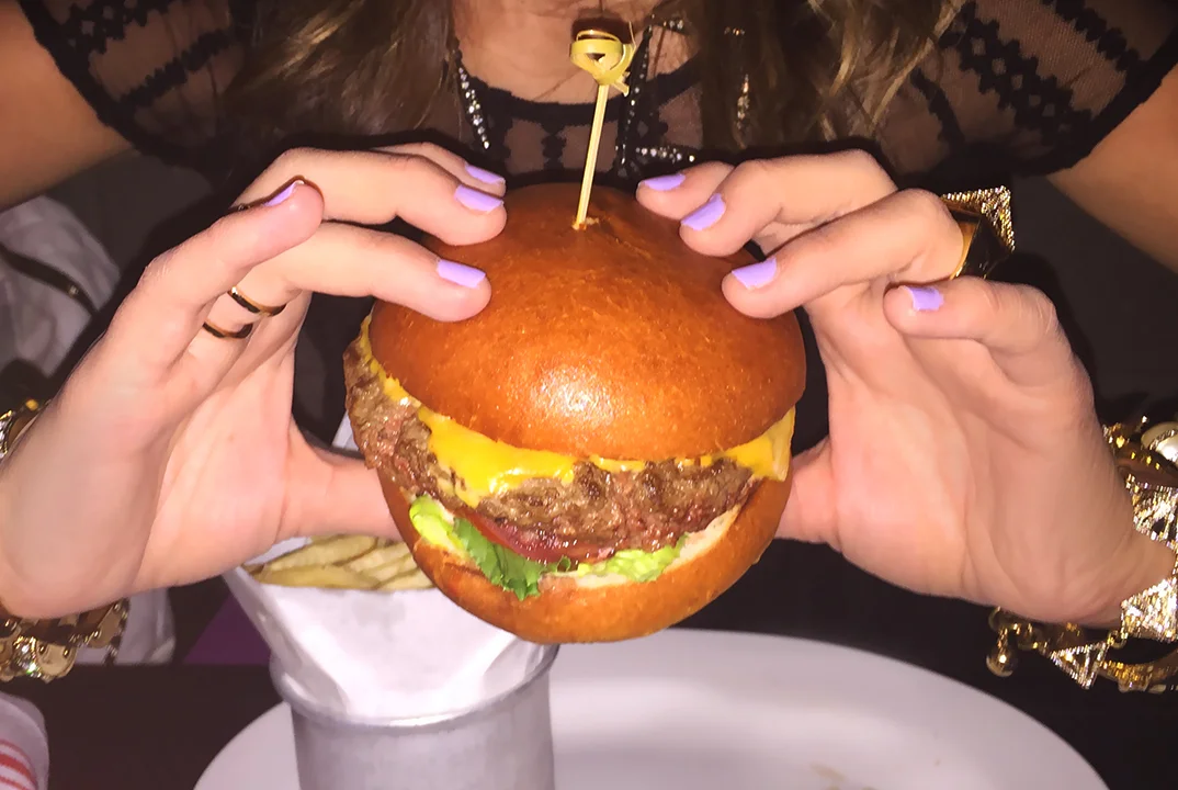 Burger by Freehold : 6oz grade "A" beef burger, topped with American cheese, lucky tomatoes, lettuce, pickled onions, and special sauce