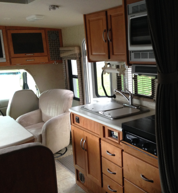 Kitchen and aisle with slide closed for travel