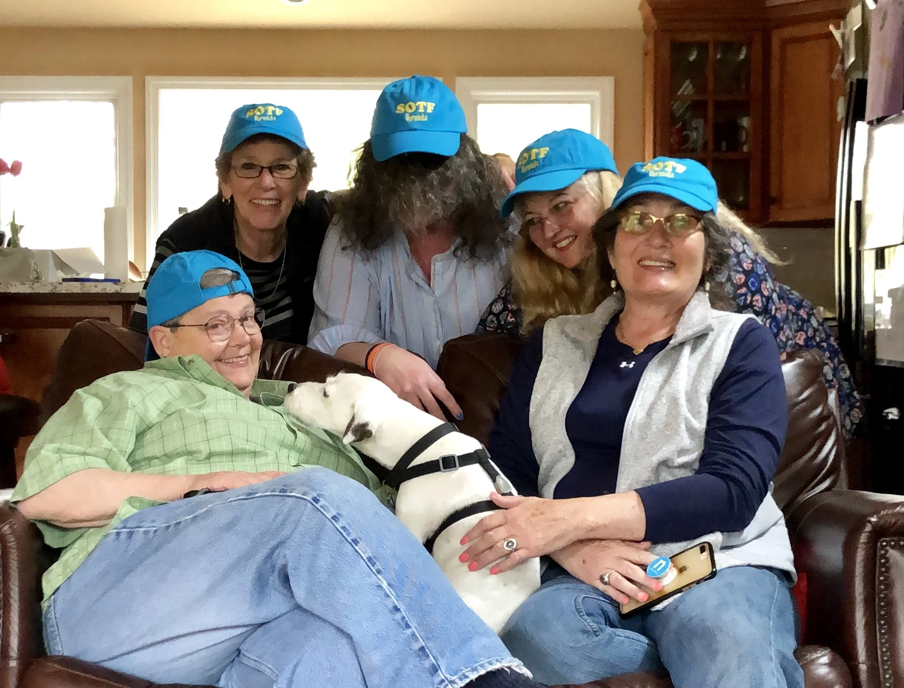 Showing off our Bermuda event hats. This dog wanted to kiss me in the worst way. They always know who is the most allergic! Jan made a great lunch for us and we got the party started.