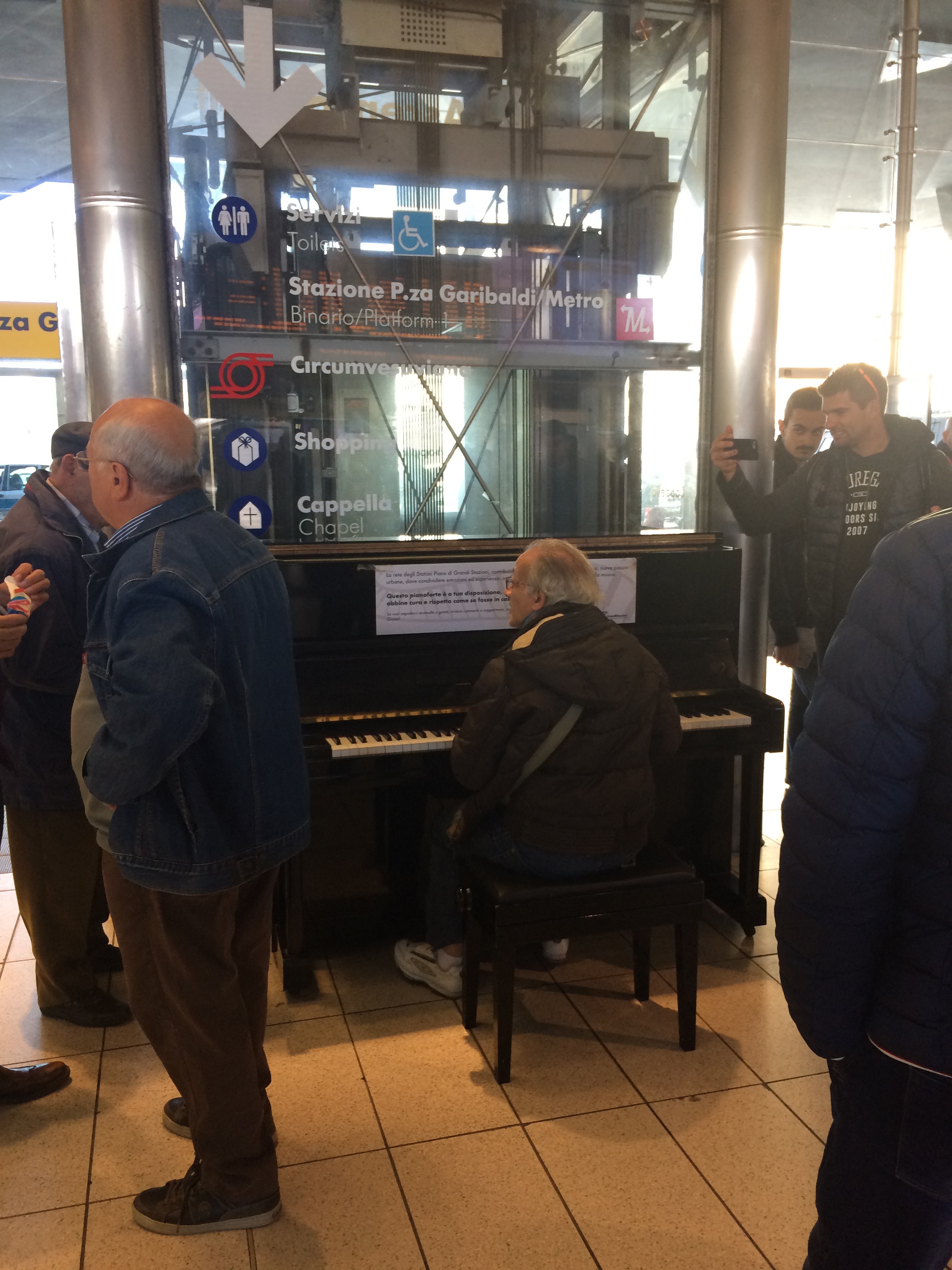 Though regretfully not taken the same day as my recent musical encounter, there is always some sort of show to be found a Napoli's central station and her piano.