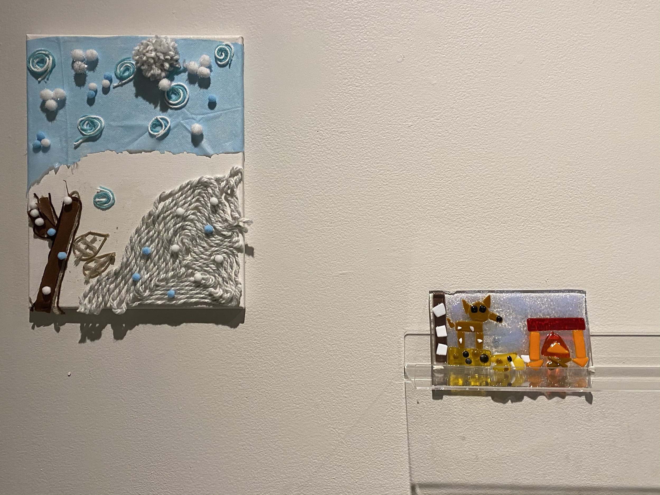  View of exhibition at VisArts, Rockville, MD, 2021, featuring recorded memories from elder adults from area that served as inspiration for children in fused glass and fabric collage workshops. 