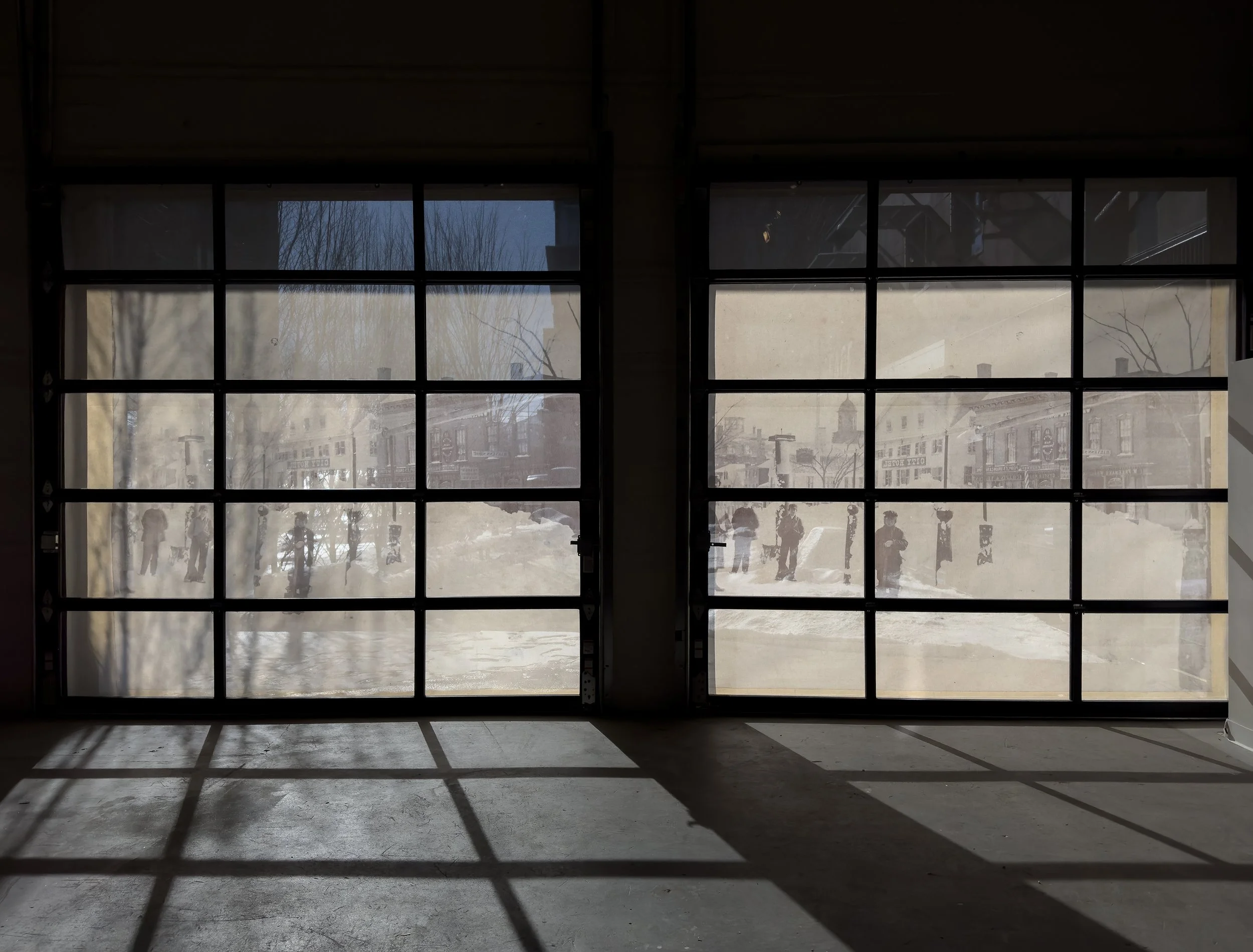 Congress Street Snowbanks, 1867, interior view of two prints on fabric in front windows, 120” x 120” each