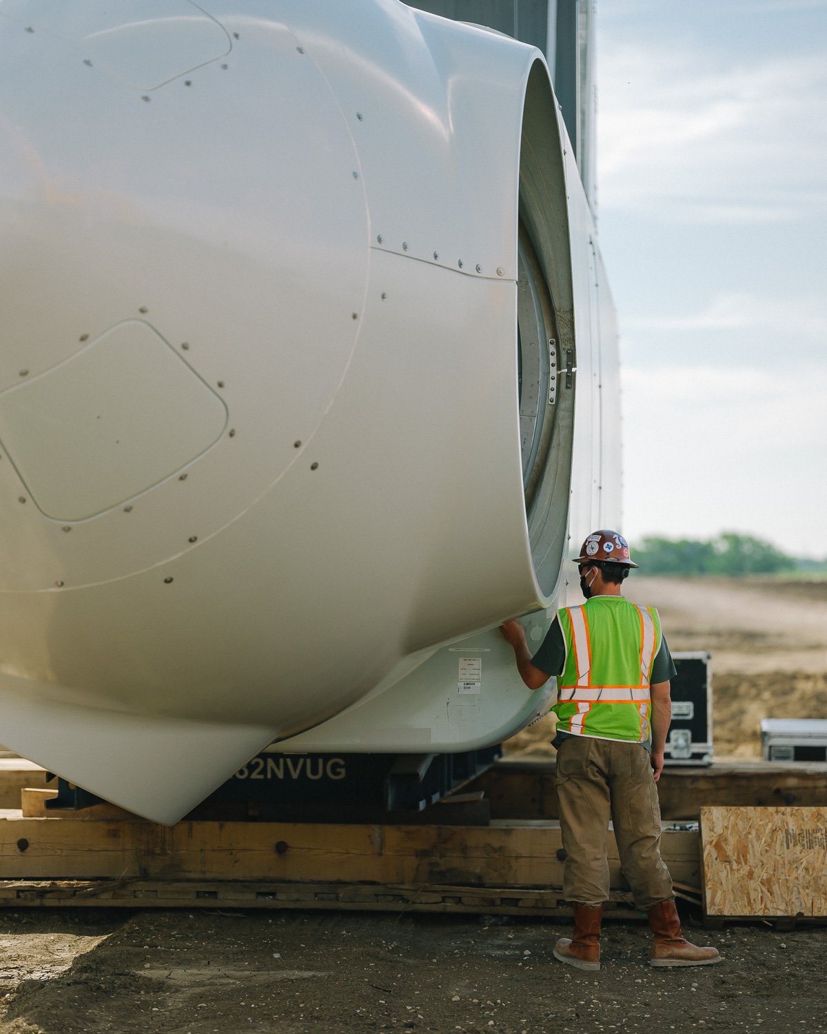  A worker inspects the head of a new wind turbine as it sits on the ground at the Milligan 1 Wind Farm Project, Western, NE, for The New York Times, 2020 