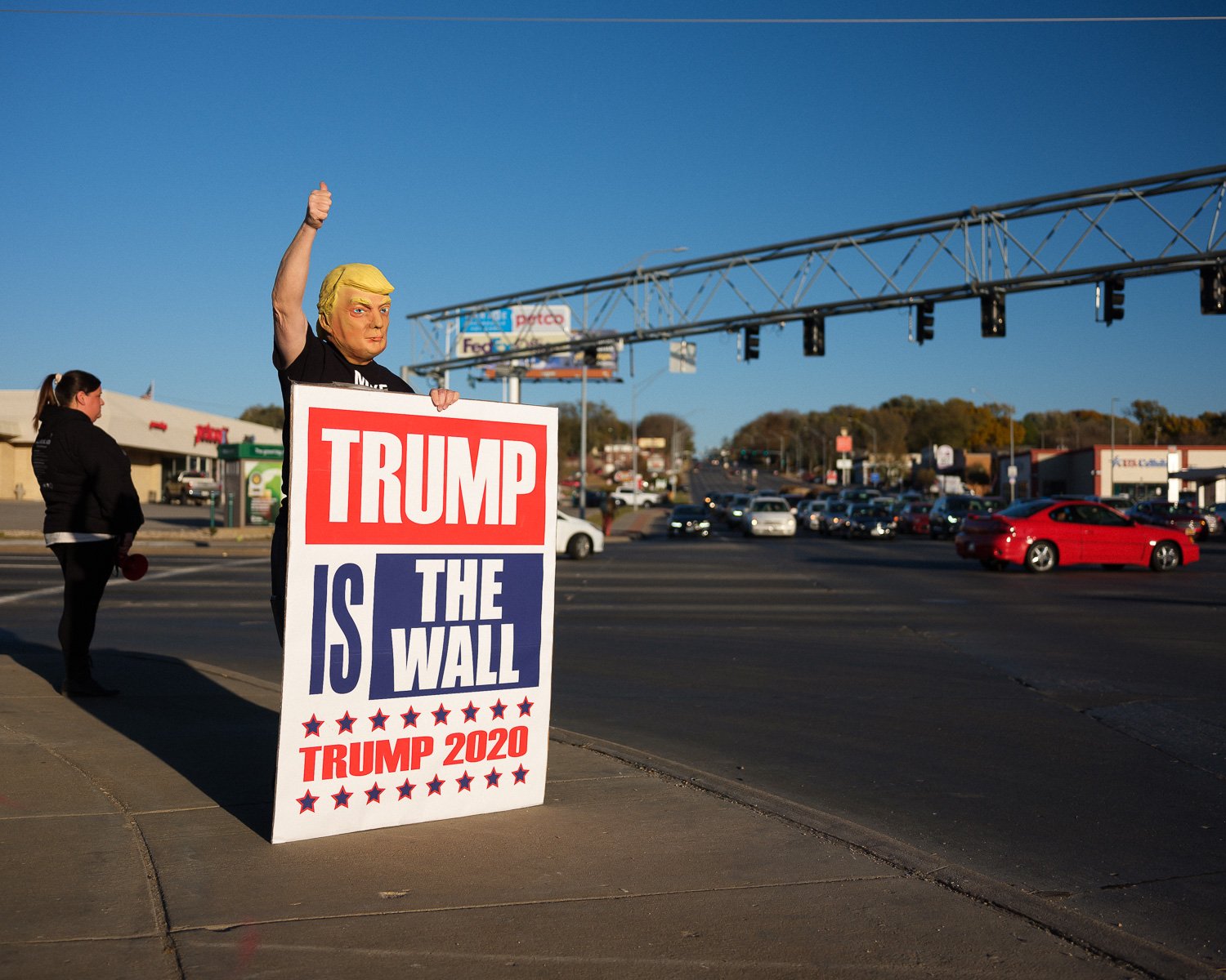  A masked Trump supporter on the corner of 72nd and Dodge, Omaha, NE, for Vanity Fair, 2020 