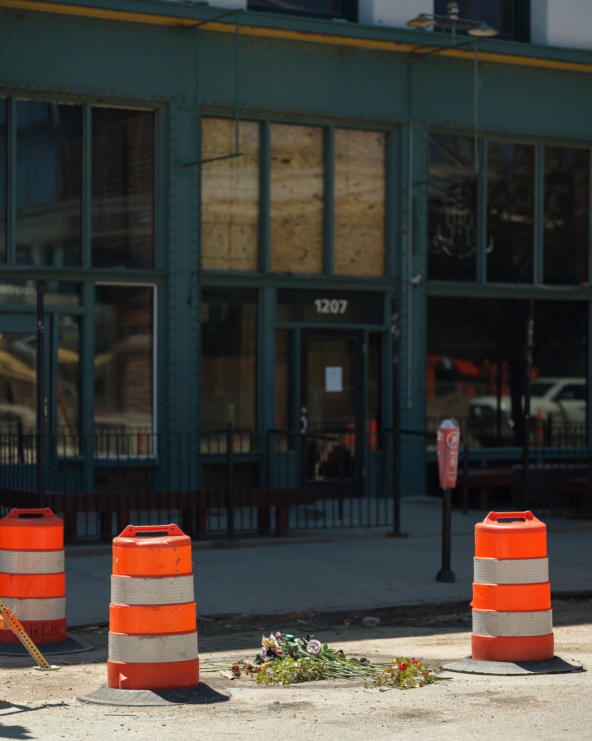  Flowers left as a memorial to James Scurlock in the location where he was killed in the Old Market District, Omaha, NE, for The New York Times, 2020 