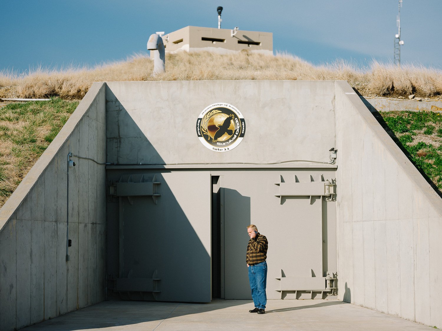  Developer Larry Hall outisde the surface level entrance of Survival Condo, his 1960s-era missile silo which he converted into a luxury 15-story bunker in Kansas, for The Wall Street Journal, 2020 