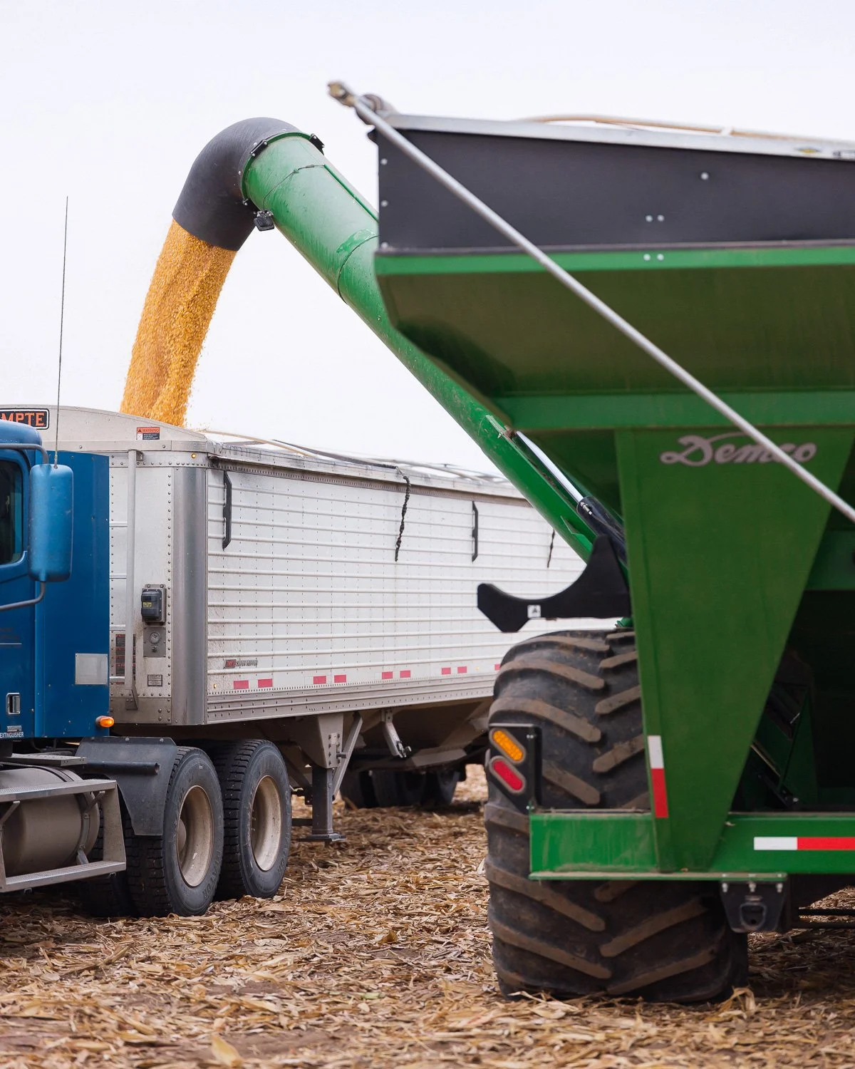  Corn is transferred to a trailer by a neighbor on behalf of farmer Jonathan Rempel after his farming equipment burned, York County, NE, for The New York Times, 2020 