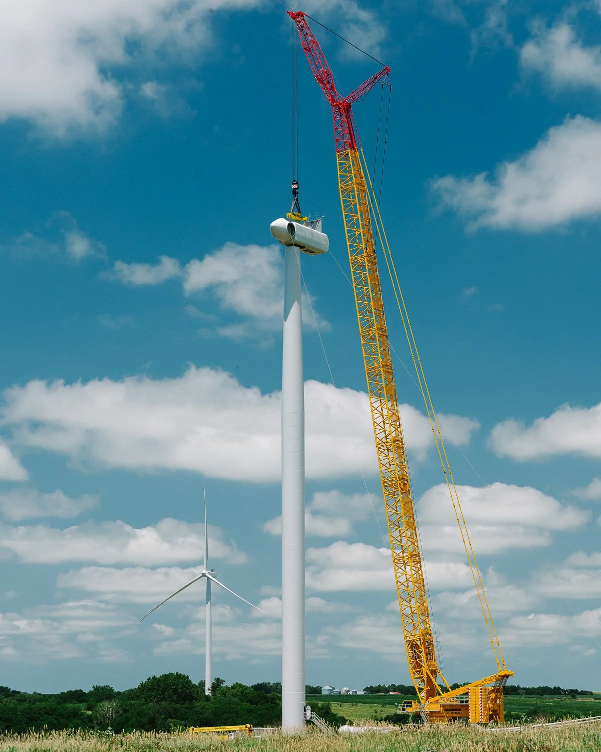  The nacelle is hoisted into position for installation atop a new wind turbine at the Milligan 1 Wind Farm Project, Western, NE, for The New York Times, 2020 