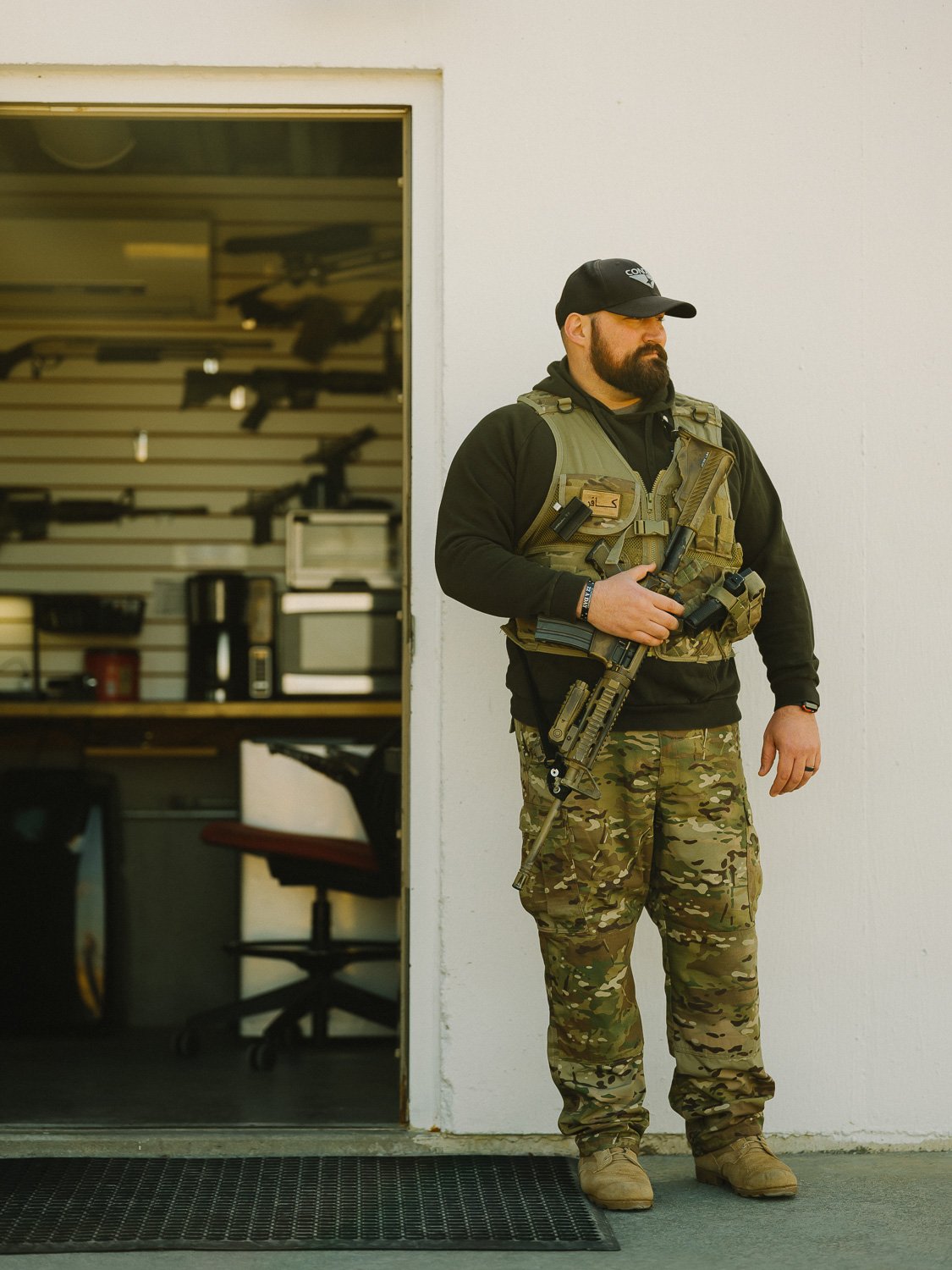  Security Officer Doug Colby stands guard at the front gate of Survival Condo, an Atlas Missile Silo turned luxury condos that extend 15 stories underground in the Kansas plains, for The Wall Street Journal, 2020 