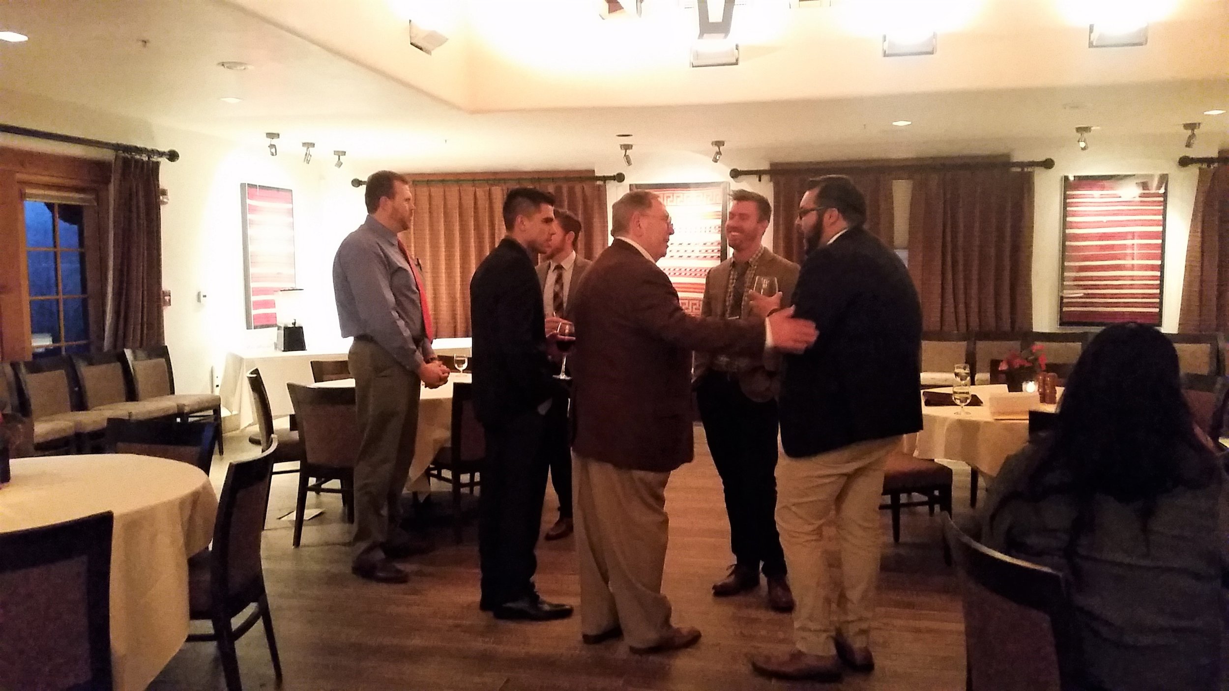 Above : Adjunct Professor, Ron Aldrich meeting with students and alum of the MHA program of UNM