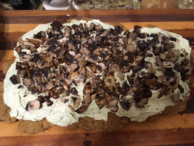Seitan with pesto cream cheese and mushrooms before being rolled up