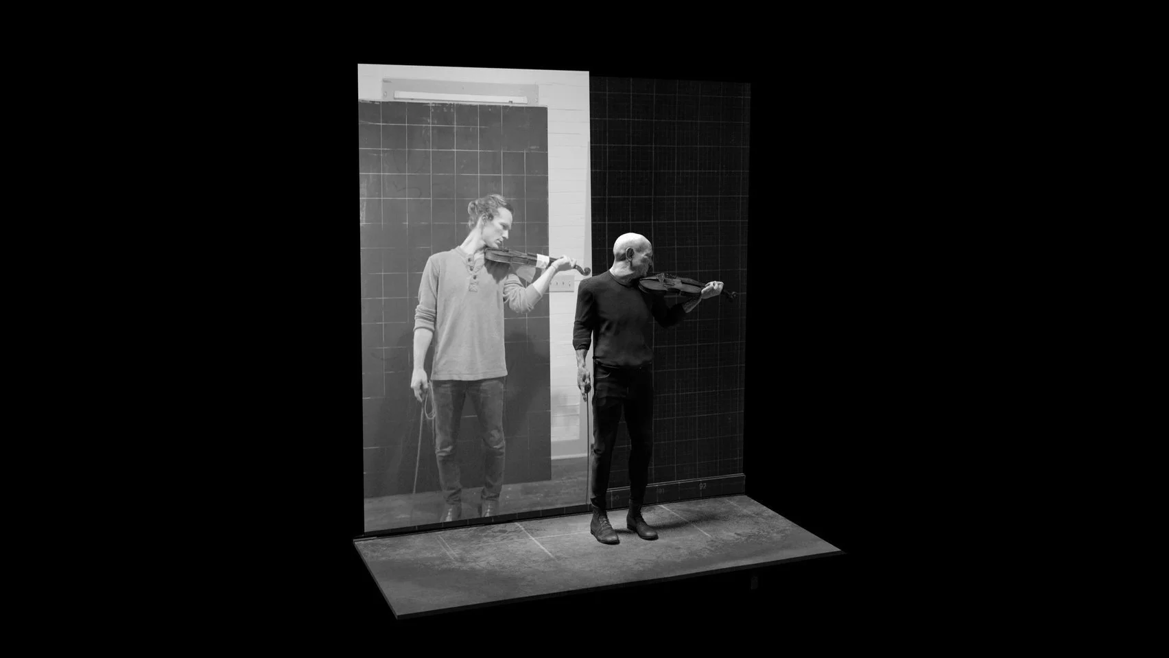 Black and white Muybridge 3D rendering of a man playing the violin with video reference of another man on the back wall of the 3D space.