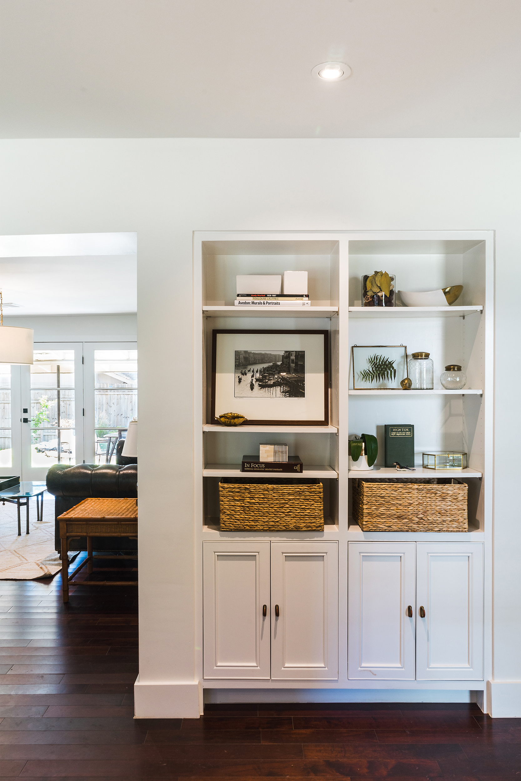 Additional bookcases were built-in and in the process, the wall between Dining and Living was built out to create a more substantial profile.
