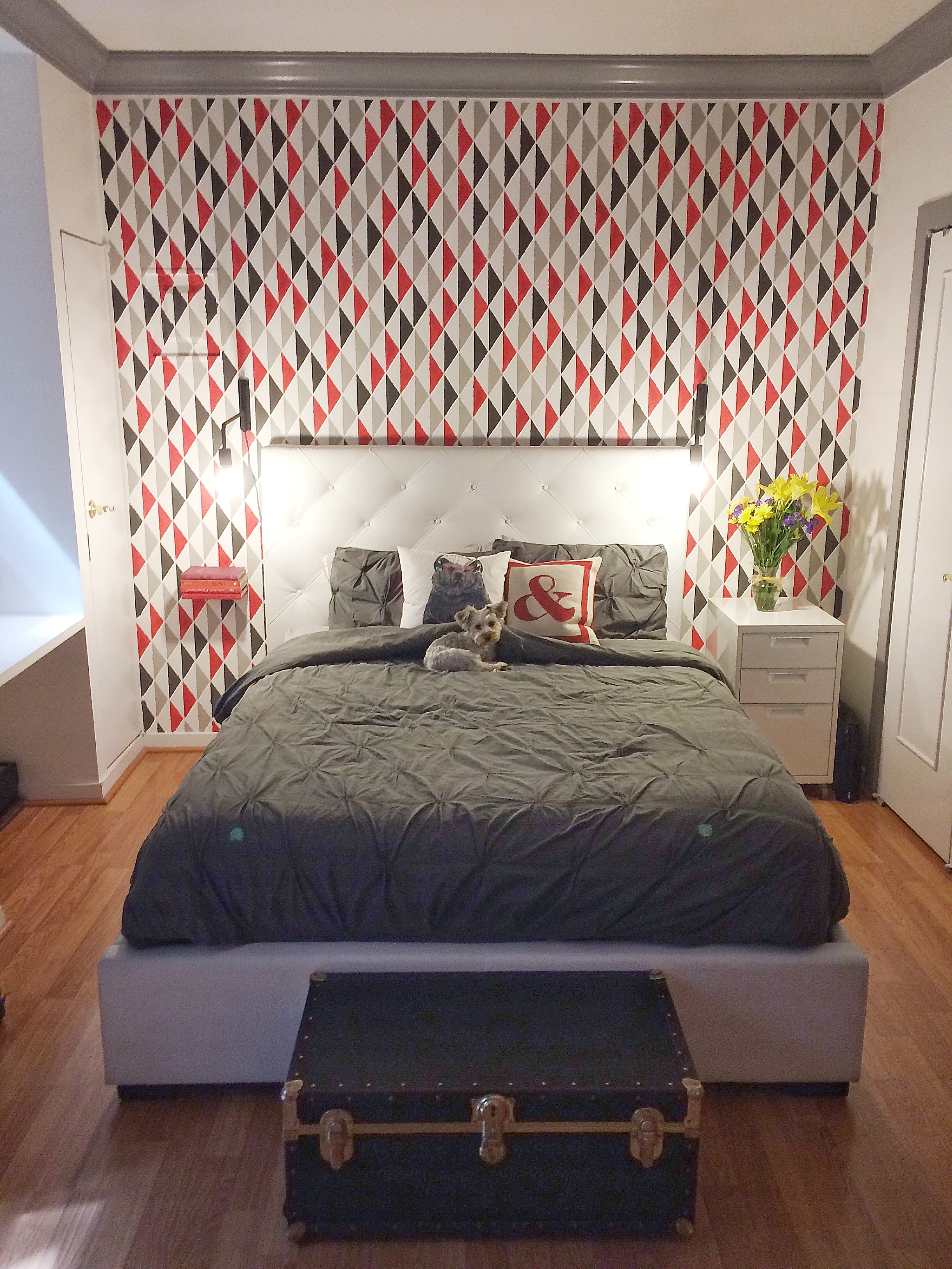 This project was a blast. We had a studio apartment with a couple different nooks. The stencil was placed behind the bed to give a real pop and definition of space. The triangle pattern was playful and enhanced the existing vibe of the apartment.