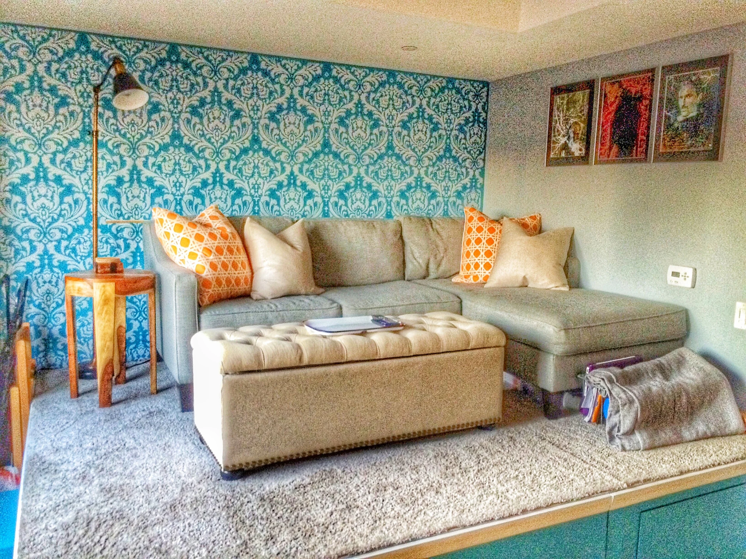 Living Area with L shaped seating and storage ottoman.
