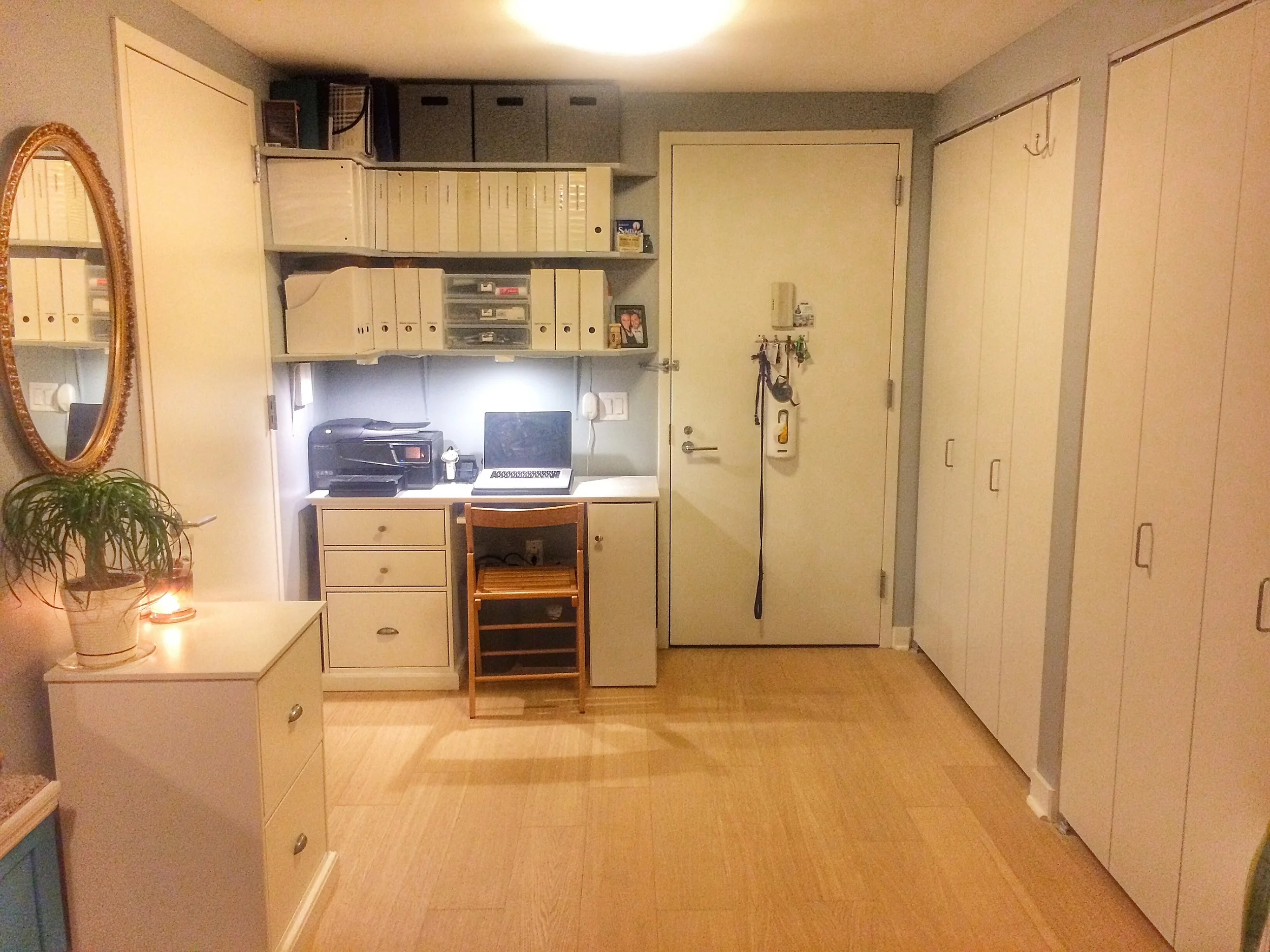Custom made desk and shelves create a separate office space.