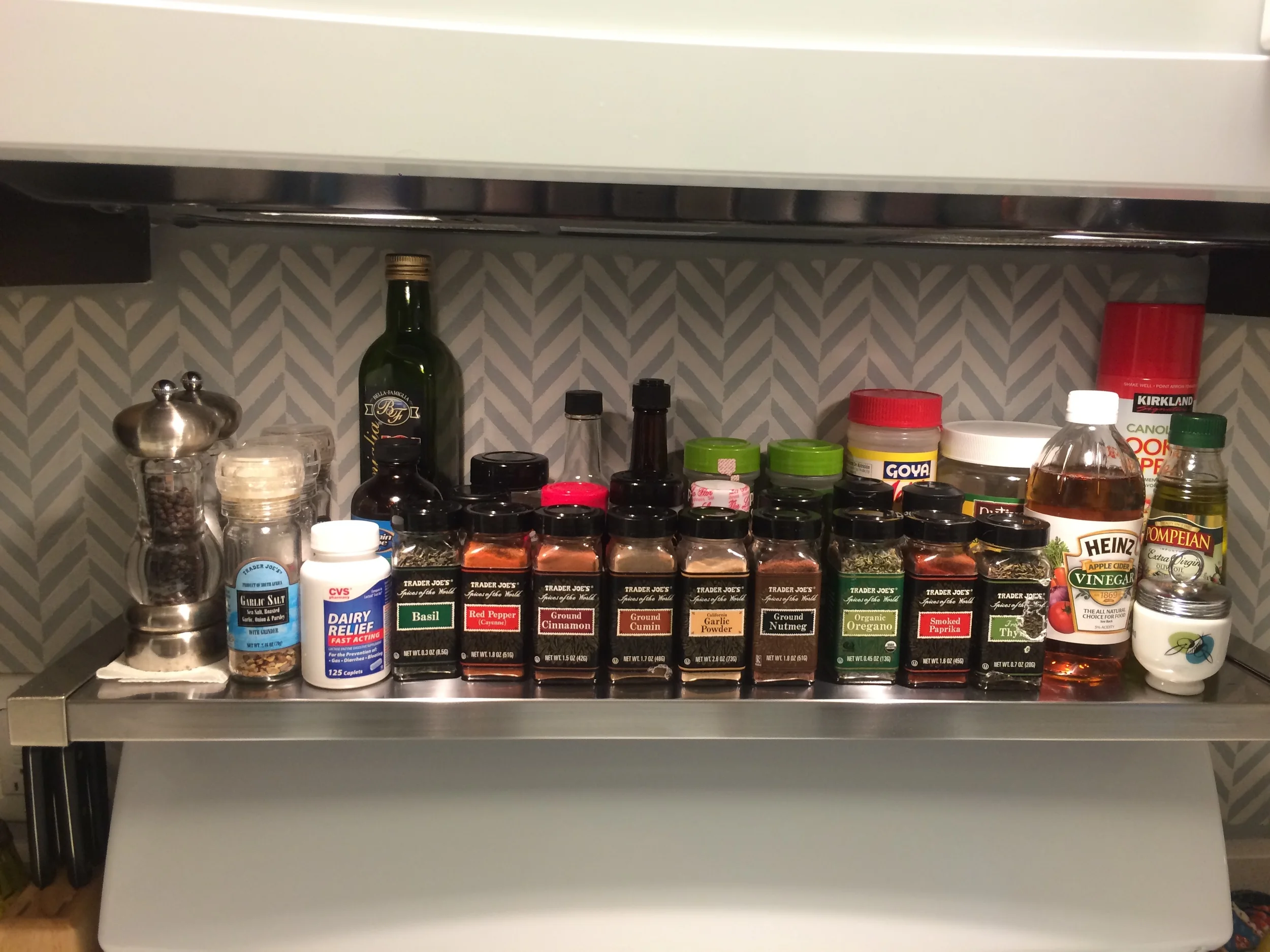 This metal shelf is a perfect fit to have easy access to spices while cooking. It also frees up space in the existing cabinets as well.